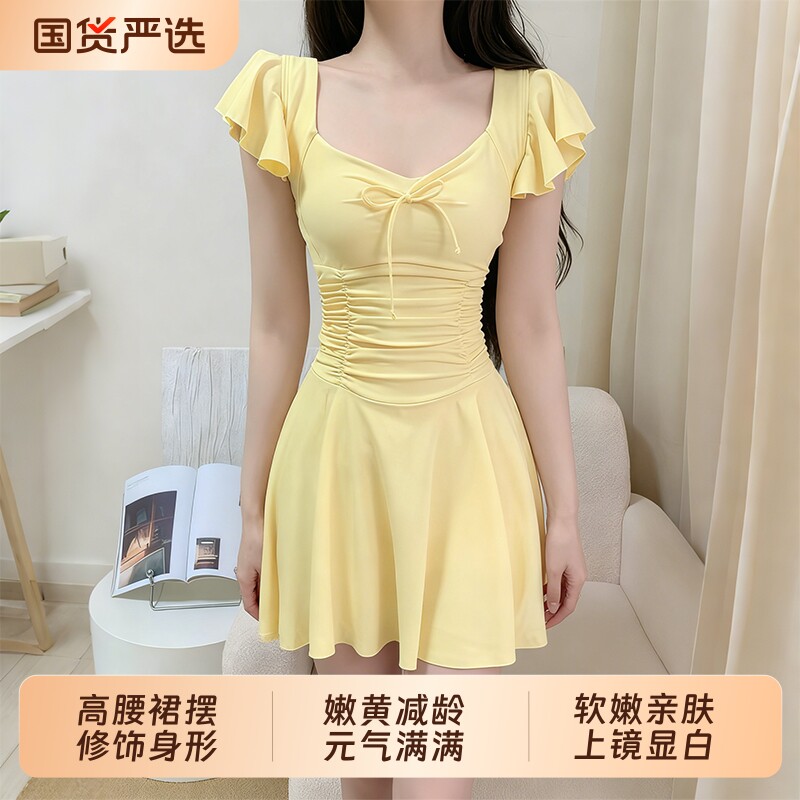 嫩黄连体泳衣女显瘦遮肚度假泳装图片