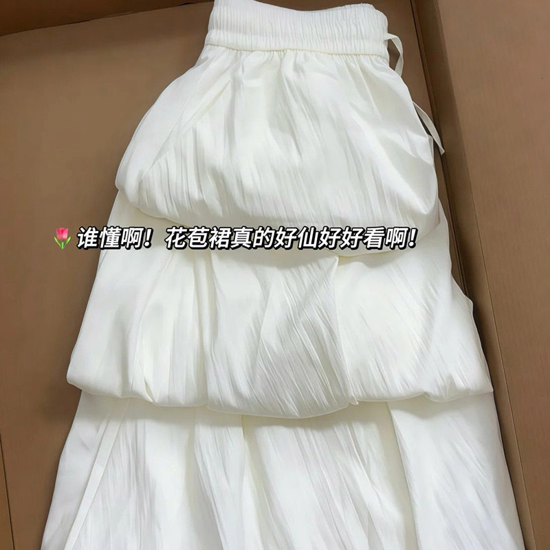 白色A字花苞裙女2026春夏季新款韩版甜美宽松型显腿长通勤半身裙
