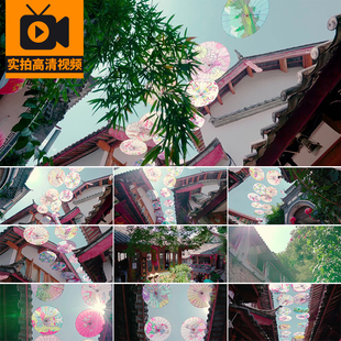 云南丽江古城古建筑唯美景花伞油纸伞旅游风景点实拍高清视频素材