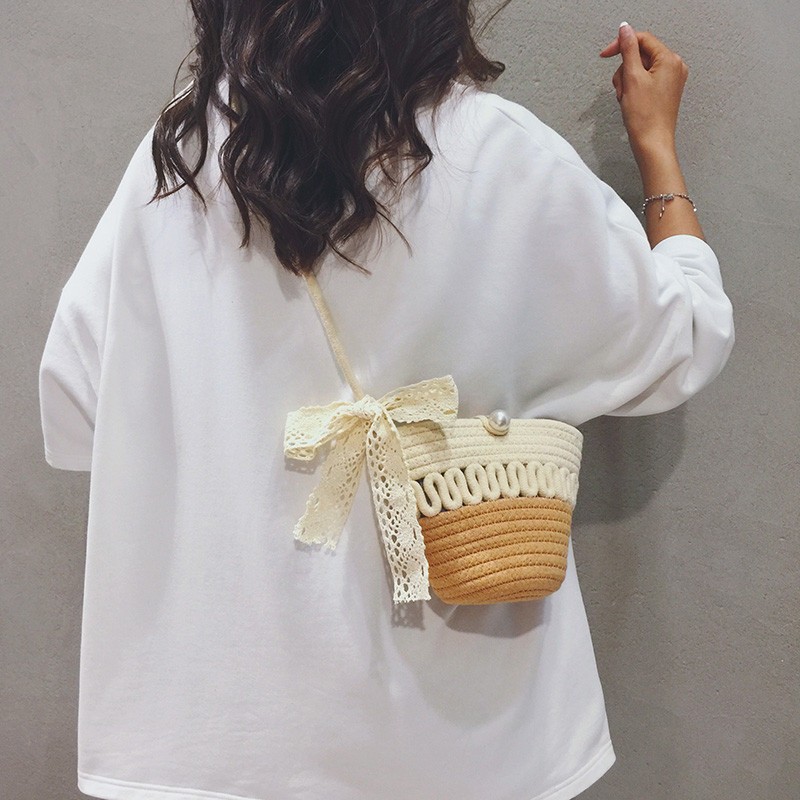 法式夏季海边沙滩草编包女包包2025新款小众百搭手机斜挎小水桶包