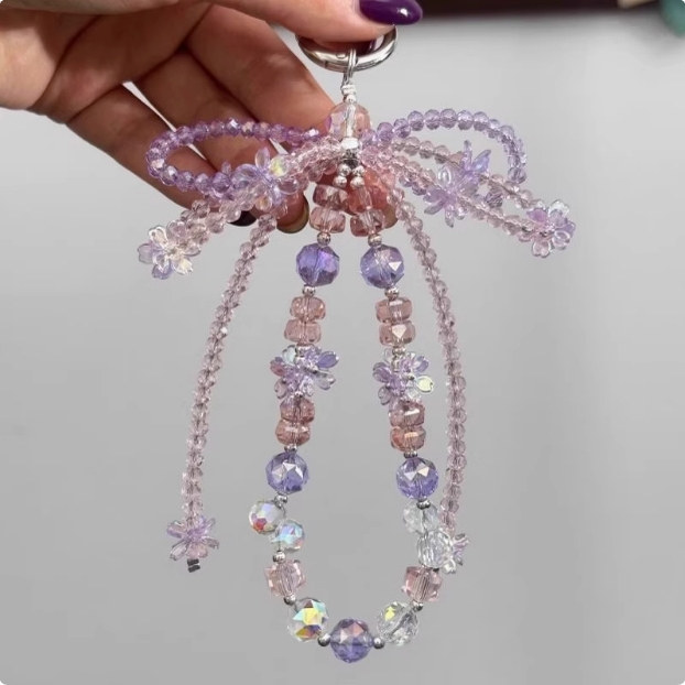 手机挂绳新款蝴蝶结水晶串珠手机链轻奢小众仙女粉晶挂链精致高级