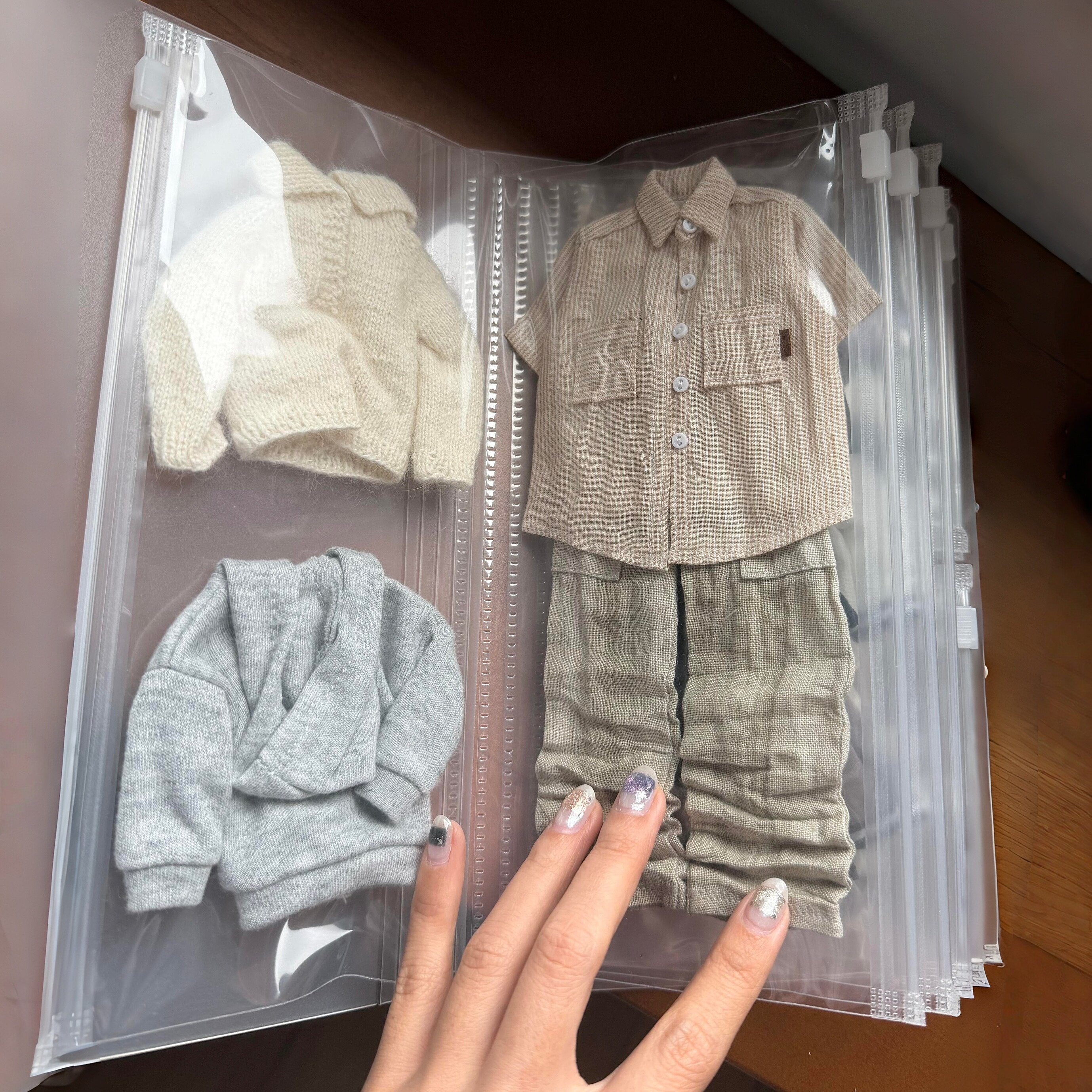 娃衣收纳袋0b22娃衣10cm娃衣自嘲熊玩偶衣服收纳防尘袋透明整理袋图片