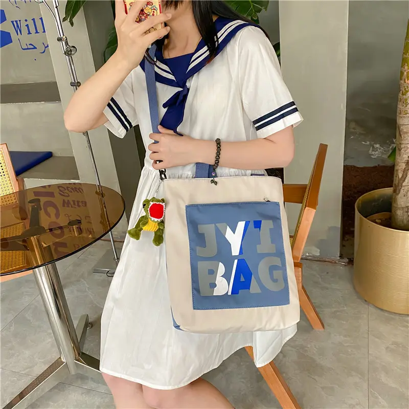 帆布包男女学生新款潮男斜挎包包大学上课包包大容量女休闲百搭