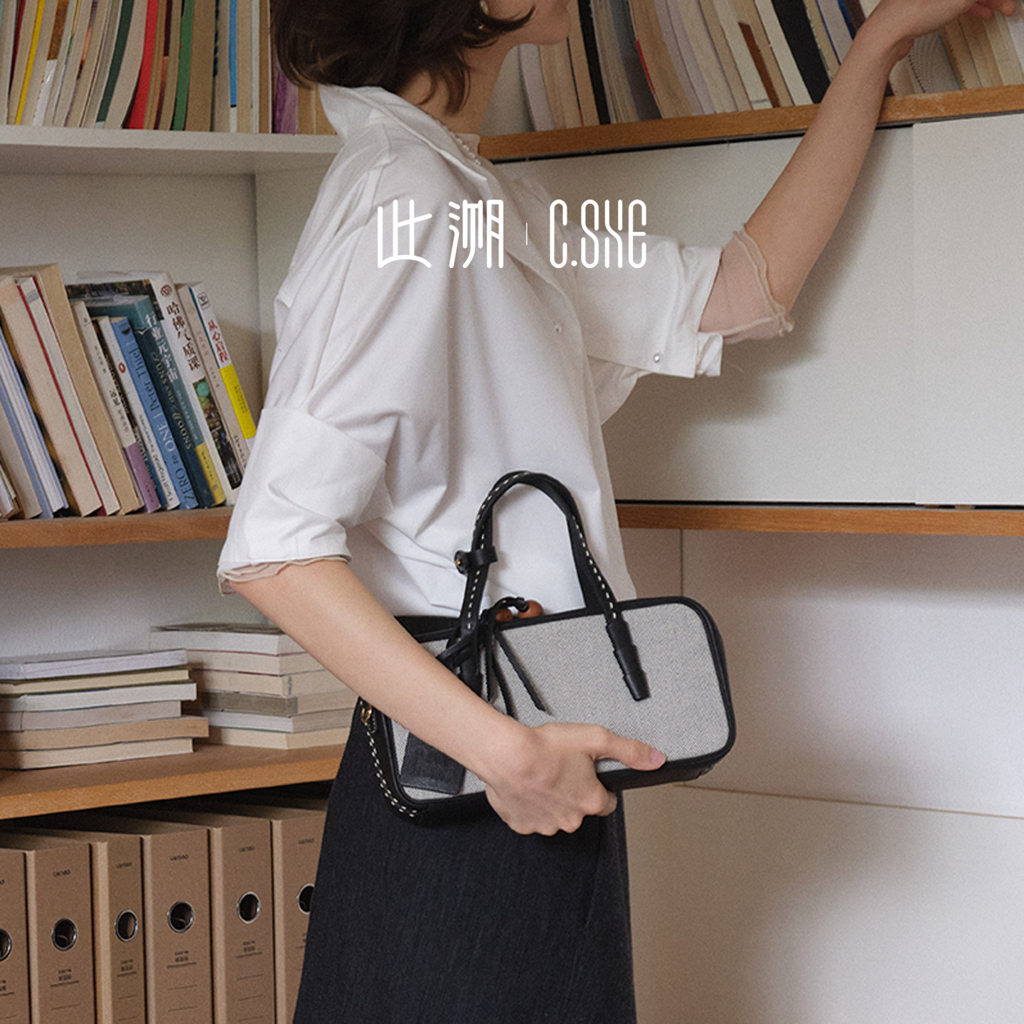 此溯头层植鞣牛皮棋盘格波士顿包