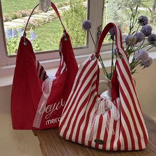 韩国帆布包女初中生条纹包夏天2025新款潮韩国字母印花双面单肩包