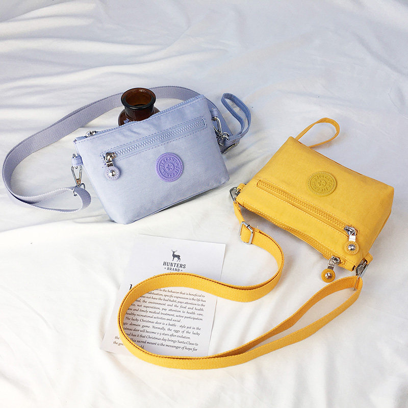 手拎包女小包斜挎迷你包帆布单肩2021年新款手机手腕包防水零钱包