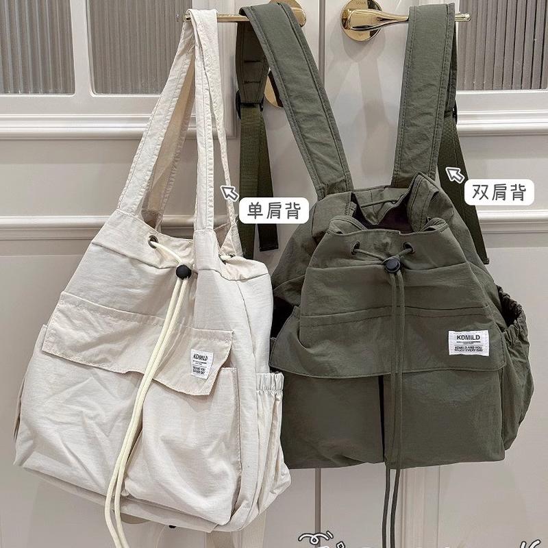 新品羽毛球包运动休闲双肩包女生大学生上课书包通勤轻便旅游山系