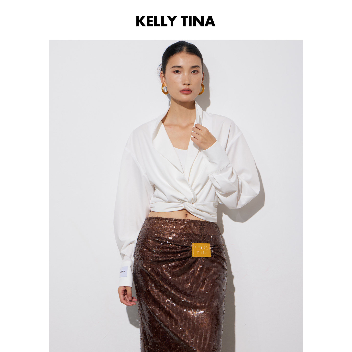 KELLY TINA羊腿袖法式轻熟风白色扭结衬衫女长袖收腰知性优雅上衣
