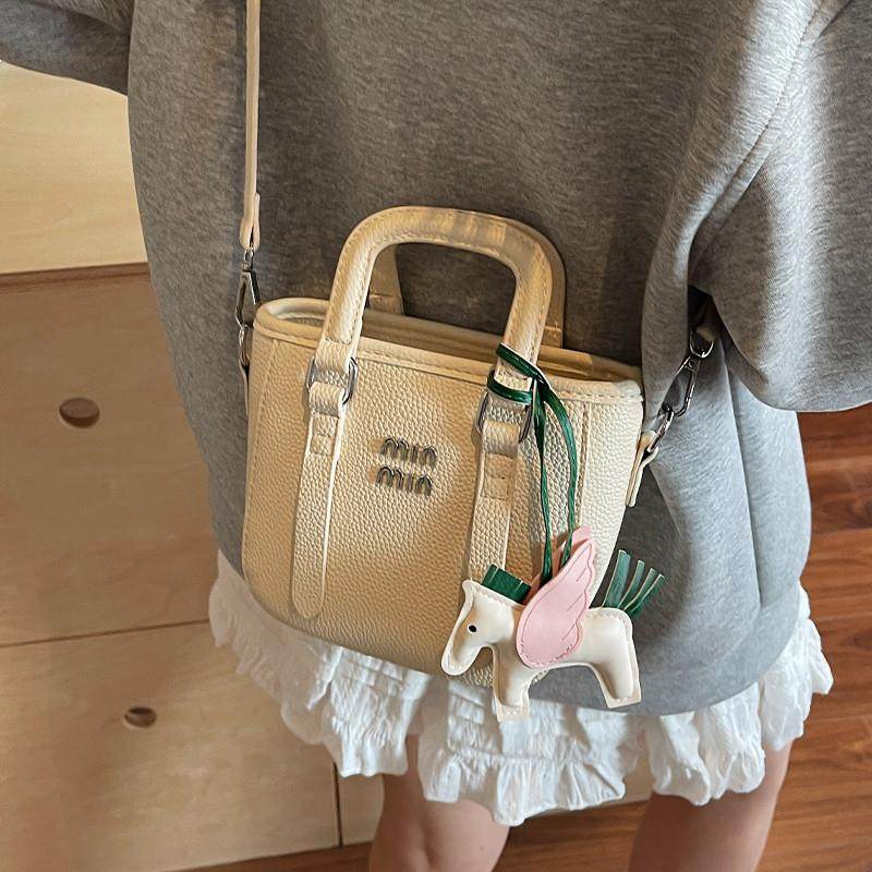 好货小众设计手提包包女2025夏季新款高级感斜挎水桶包时尚百搭通,箱包皮具/热销女包/男包,水桶包,淘宝优惠券,粉丝福利购,淘宝优惠卷