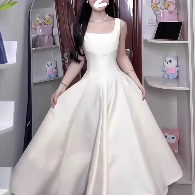 杏色吊带连衣裙女气质法式赫本风小个子高级感显瘦收腰长裙小白裙