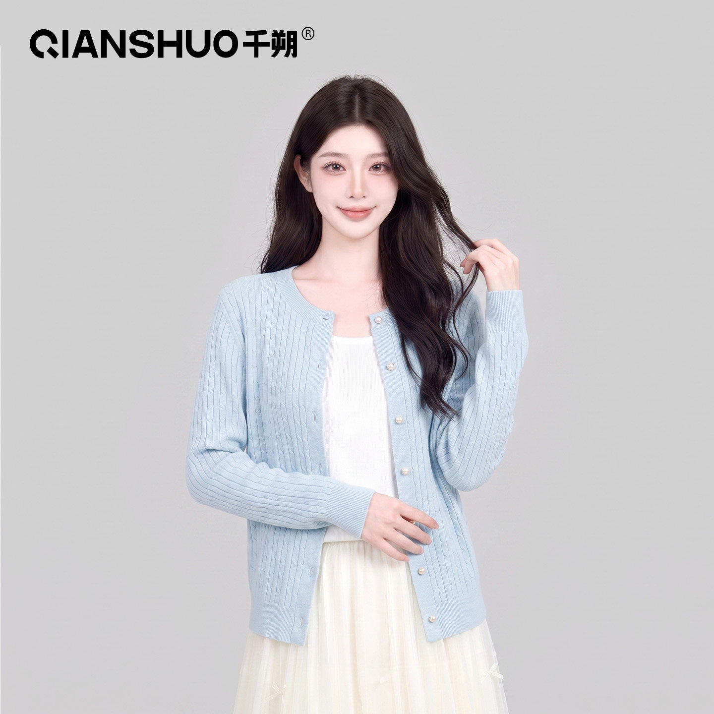 千朔圆领针织开衫女2026秋冬新款长袖高级感纽扣显瘦外搭外套上衣