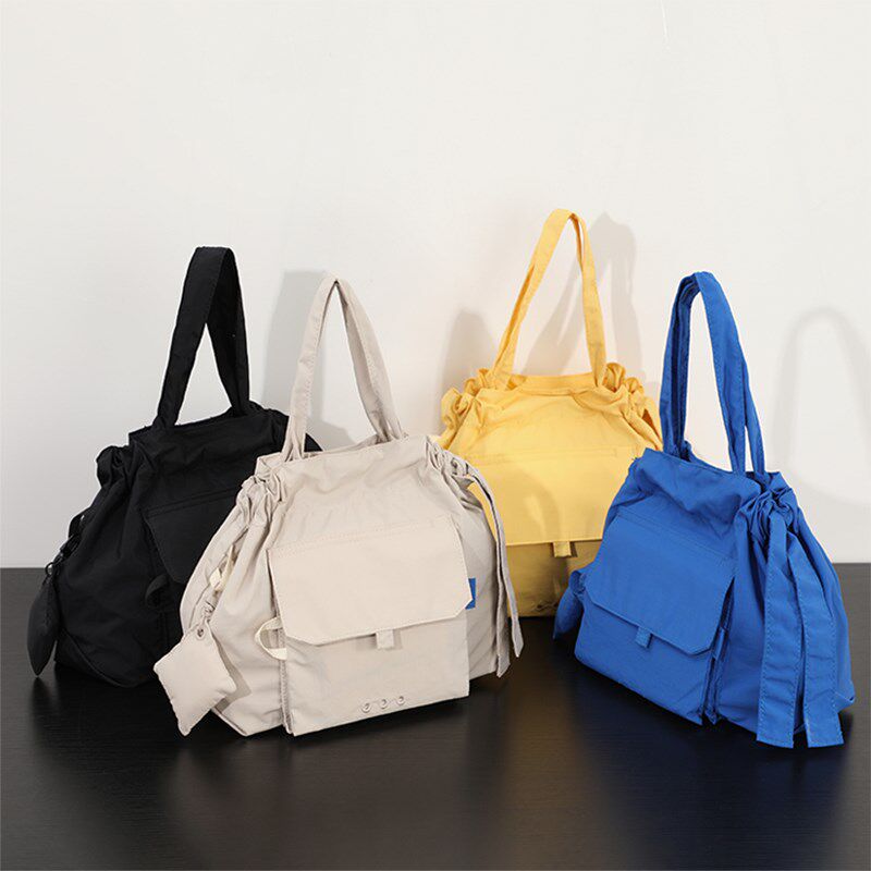 斜挎手提包女两用设计感小众上班通勤旅行超轻黄色尼龙洋气小包包