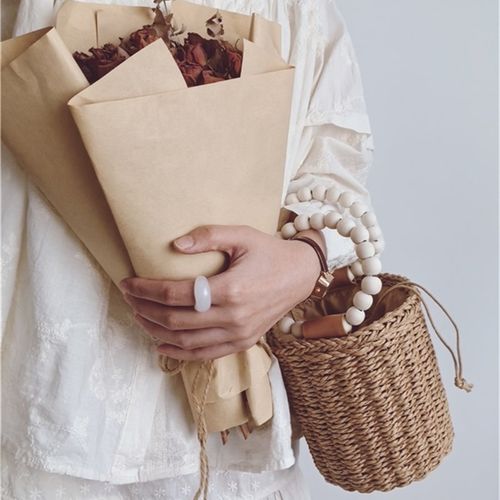 包包202f4夏季新款海边沙滩草编包木珠手提圆筒水桶包