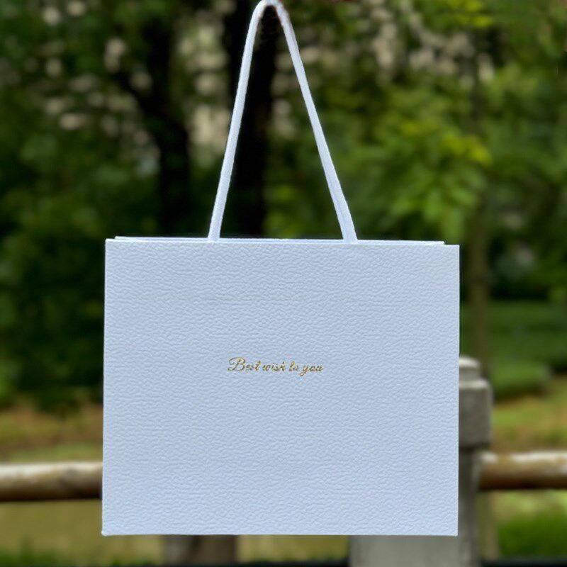 高级感手提袋精致皮纹白色u礼物袋洋气高档化妆品礼盒包装袋简约