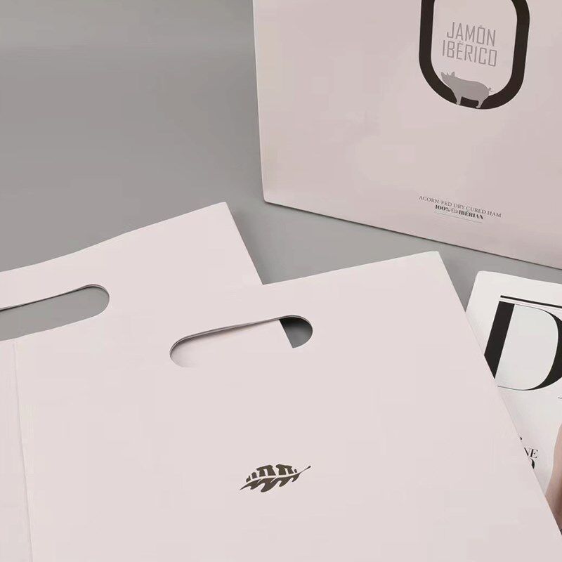 手提纸袋定制印刷logo定做服装店广告公司企业礼品袋镂空挖孔手提