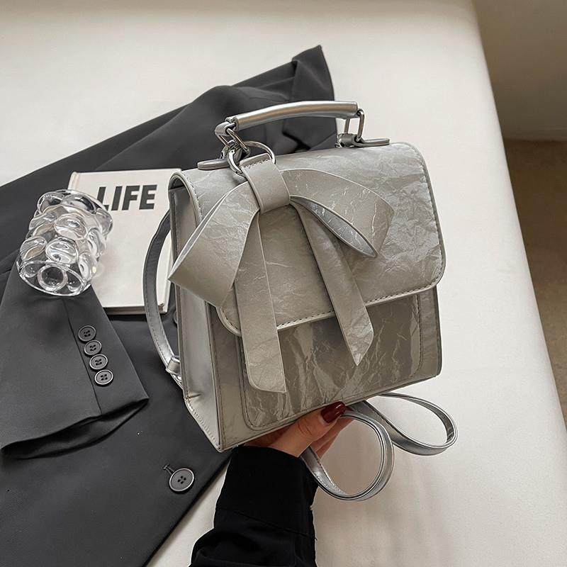 推荐蝴蝶结双肩包女2025新款设计感小众书包学生通勤旅行后背包斜