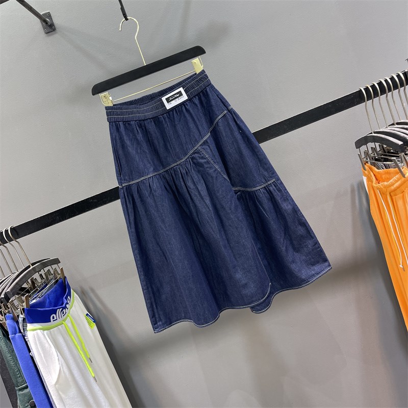 深蓝色牛仔半身裙女2025夏季薄款松紧腰不规则拼接大摆A字中长裙