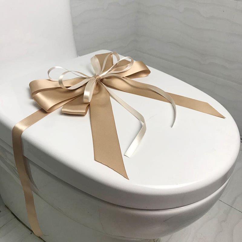 样板房间卫生间马桶装饰蝴蝶结拉花卫浴展厅新房交付绑花封条摆件