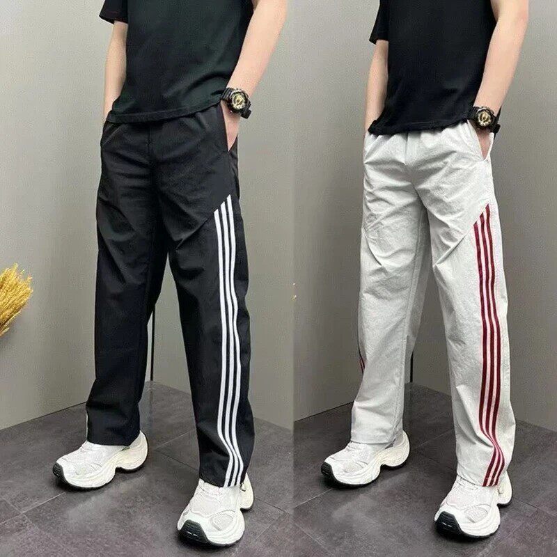狸李精品服饰个体店3夏季新款运动条纹拼接休闲裤男士阔腿直筒长