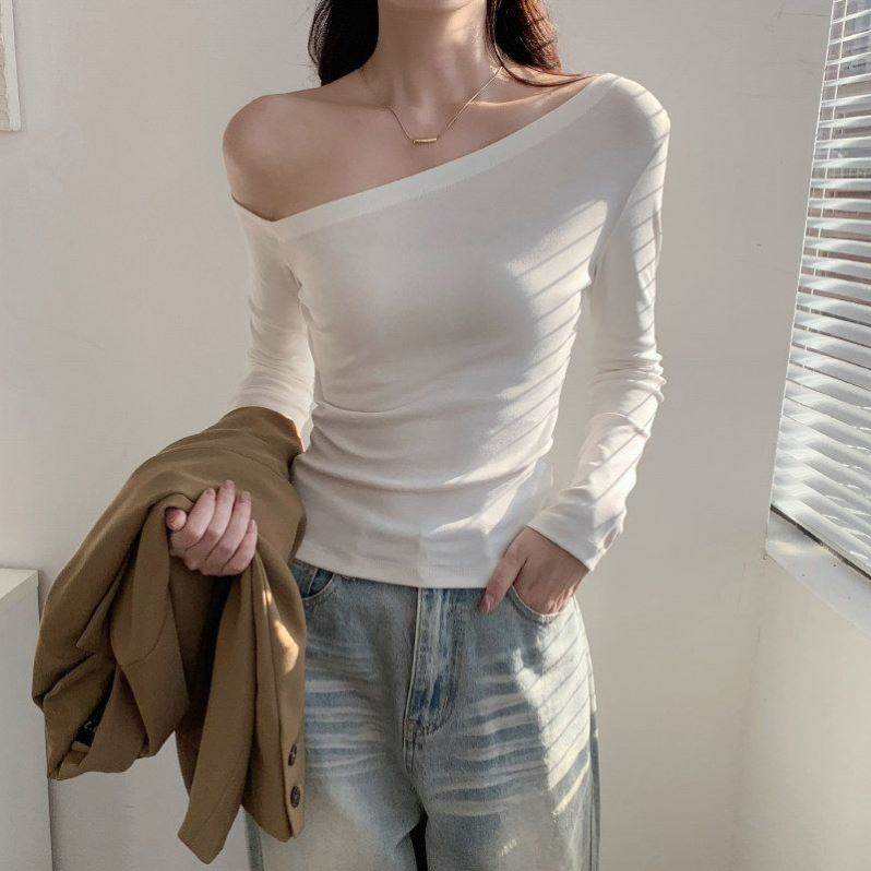 白色斜肩长袖t恤女春秋 2026新款纯欲露肩性感辣妹绝美设计感上衣