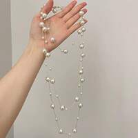 A high-end cream-colored pearl-like necklace for autumn and winter, featuring a light luxury layer-and-wear long design and a multi-layered beaded sweater chain thumbnail 3