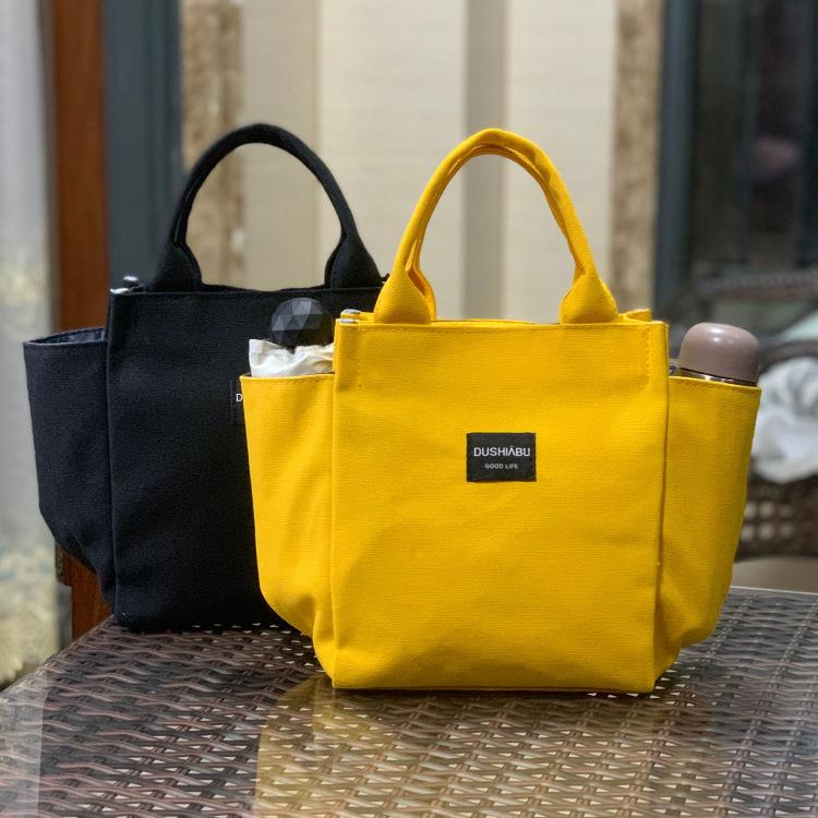 经典款式帆布带水杯位多口袋手提饭盒袋妈咪包上班手拎便当包