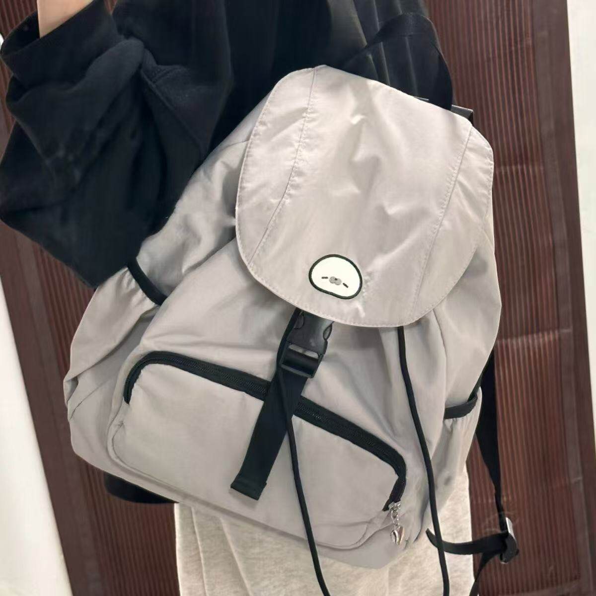 新款小海豹抽绳双肩包小众男女轻便大容量户外运动登山背包旅游