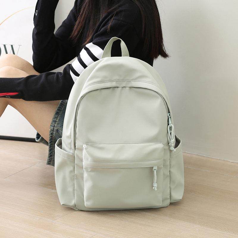 纯色双肩包简约百搭大容量电脑旅行背包男初中生高中大学生书包女