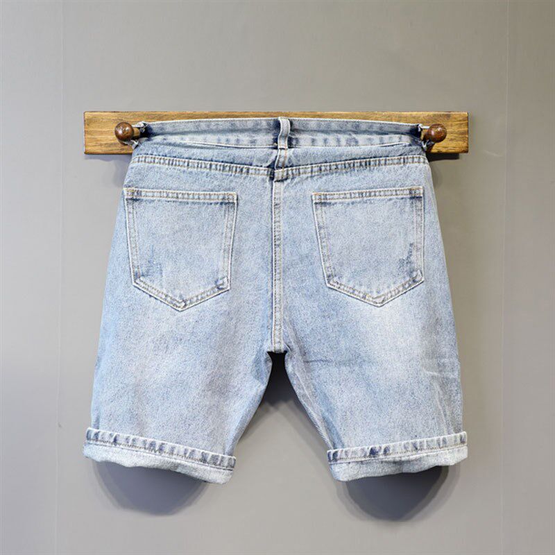 夏季新款浅蓝色水洗简约百搭牛仔短裤男士个性皮标装饰青年五分裤