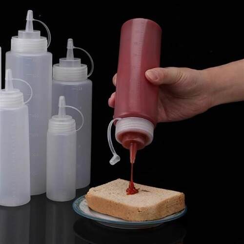 Squeezable sauce bottle with measurements for ketchup, salad