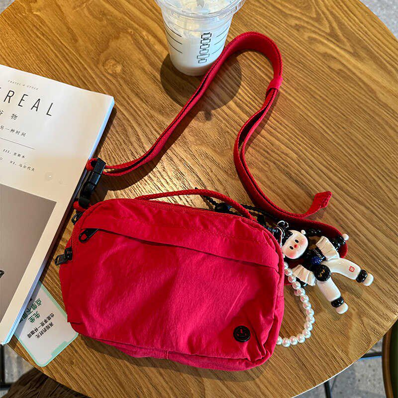 手机包包斜挎腰包小众百搭女式胸包户外休闲运动跑步超轻便小布包