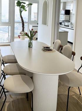 88528奶风椭岩板餐桌椅组合家用餐小户圆型油实木桌简约现代长方