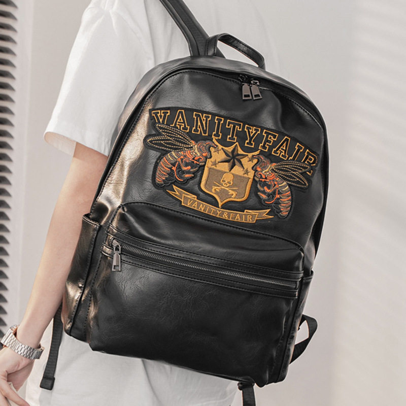 新款个性刺绣双肩包 韩版男包街头潮时尚电脑包青年背包学生书包