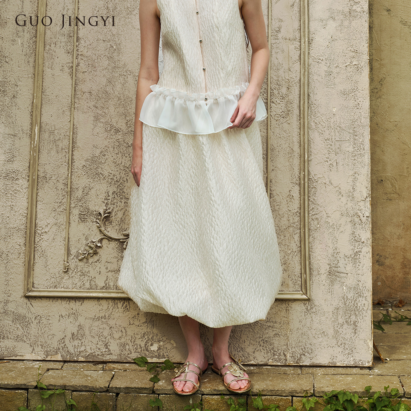 GUO JINGYI2026早秋新品少女风简约时尚杏色鱼鳞花苞长款半身裙女