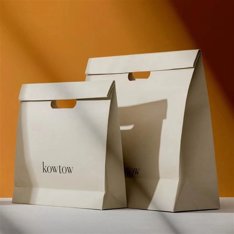 镂空手提纸袋礼品袋手提纸袋定制印刷logo大小服装纸袋定制