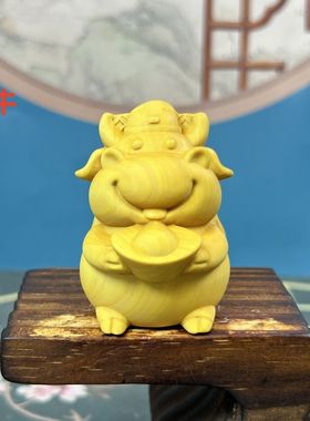 黄杨木雕生肖牛招财手把件