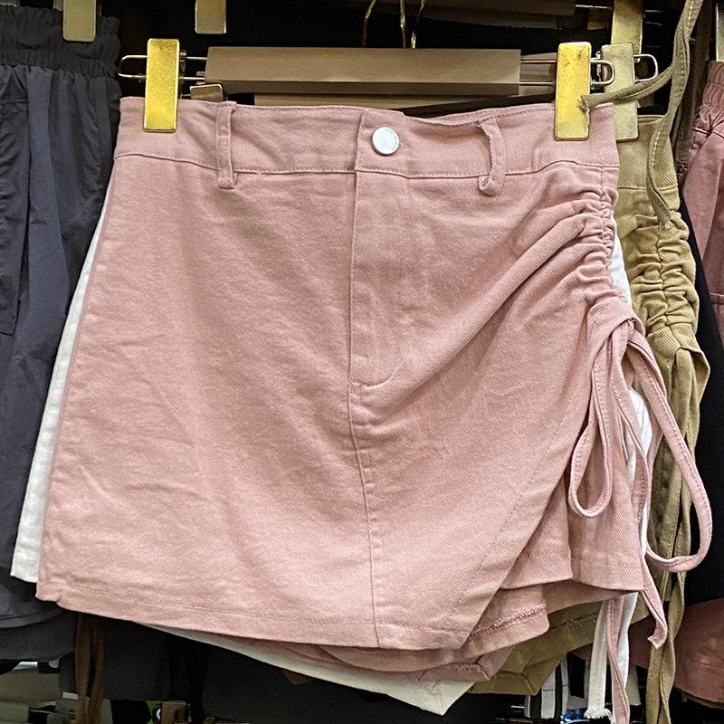 白色牛仔短裙新款夏秋季高腰a字女款设计感不规则抽绳半身裙裤子