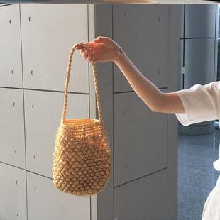 发财桶包编织包女夏手工织包单肩草编藤编草包海边度假沙滩水桶包