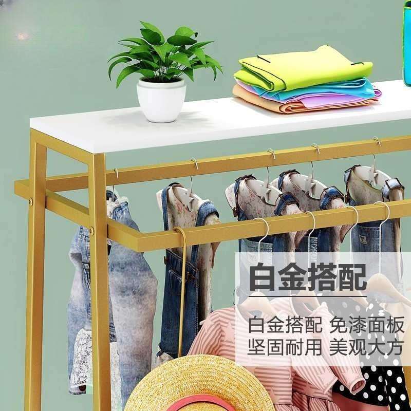童装店铺货架服装中岛展示台中间摆放桌子金色落地式服装店中岛架