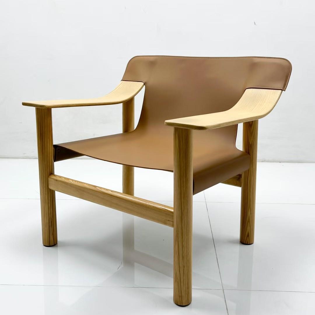 北欧实木休闲椅复古马鞍皮靠背扶手椅民宿家用单人沙发椅设计师椅