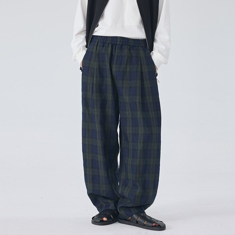 2025年春夏新款男士长裤宽松亚麻墨绿格子休闲松紧腰弯刀裤潮流