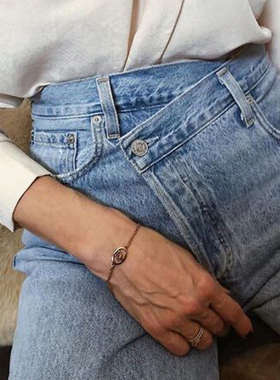 腰部交叉纽扣错位牛仔裤女设计师款做旧高腰宽松显瘦bf风直筒裤秋