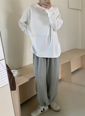 秋季黑/白色长袖叠穿t恤 下摆弧形显瘦宽松休闲打底衫女内搭t恤衫