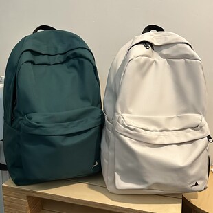 日韩纯色大容量简约书包女百搭黑色双肩包男大学生初中生旅行背包