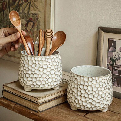 Pinecone-shaped three-legged ceramic storage jar and kitchen