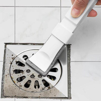 Scouring pad cleaning brush for removing dirt from crevices