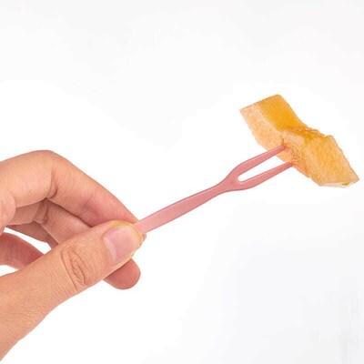 A set of disposable plastic fruit forks, with a two-pronged