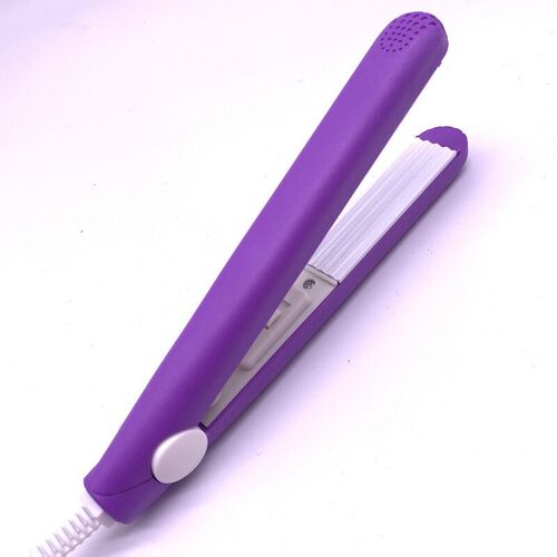 A mini hair iron pink corrugated plate electric curling iron