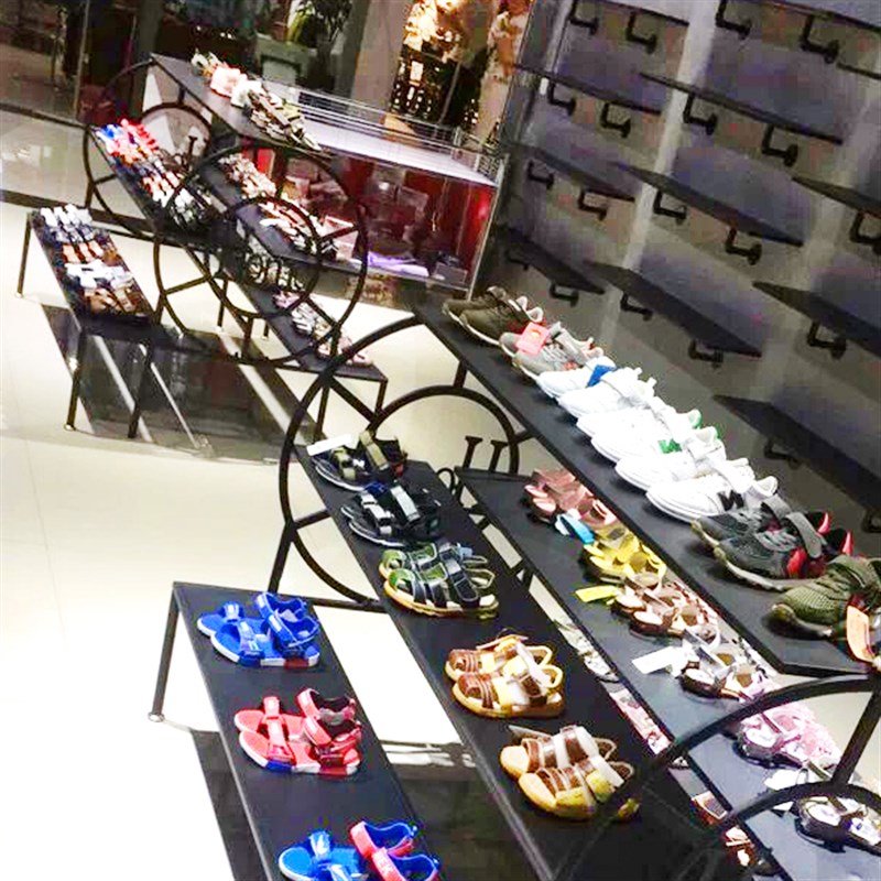 服装店流水台展示架落地铁艺个性创意高低展示桌中岛装饰多层鞋架图片