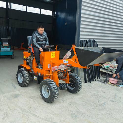 养殖场清粪建筑工地四驱电动柴油装载机抓草农用小型电动铲车